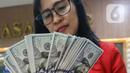 <p>Sementara itu, indeks dolar yang mencerminkan nilai tukar dolar AS terhadap mata uang utama dunia ada di 106,22, naik dari sehari sebelumnya yang ada di 106,12. (Liputan6.com/Angga Yuniar)</p>