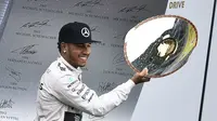 Lewis Hamilton ekspresikan kemenangan di Belgia (JOHN THYS / AFP)