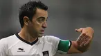Legenda Spanyol dan Barcelona, Xavi Hernandez saat berlaga di pertandingan antara Qatar Stars League melawan Lekhwiya di Doha (27/11/2015). Xavi mengaku sudah mulai beradaptasi dan senang bisa bermain di Qatar.(AFP Photo/Karim Jaafar)