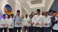 Ketum Partai Demokrat Agus Harimurti Yudhoyono (AHY) bersama Bakal Calon Presiden Koalisi Perubahan Anies Baswedan menghadiri buka bersama yang diadakan Partai NasDem di NasDem Tower, Jakarta Pusat, Sabtu (25/3/2023). (Merdeka.com/Ahda Bayhaqi)