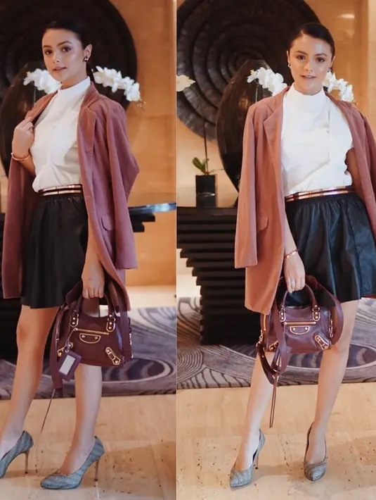 Selain itu, Amanda juga sering berpenampilan girly. Seperti yang satu ini misalnya, Amanda cantik banget memakai rok hitam dengan paduan turtle neck putih dan outer berwarna pink. Ditambah, ia memakai heels abu-abu. (Instagram/amandarawles)
