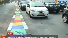 Di sejumlah kawasan perluasan pemberlakuan ganjil-genap spanduk sosialisasi telah terpasang.