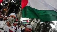 Aksi kepedulian terhadap Palestina di Bundaran HI, Jakarta, Jumat (14/11/2014). (Liputan6.com/Johan Tallo)