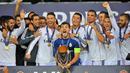 Gelar ketiga adalah trofi Piala Super Eropa. Real Madrid berhasil menang 2-0 atas Sevilla dalam laga yang digelar di Cardiff Stadium, 12 Agustus 2014. (AFP/Glyn Kirk)