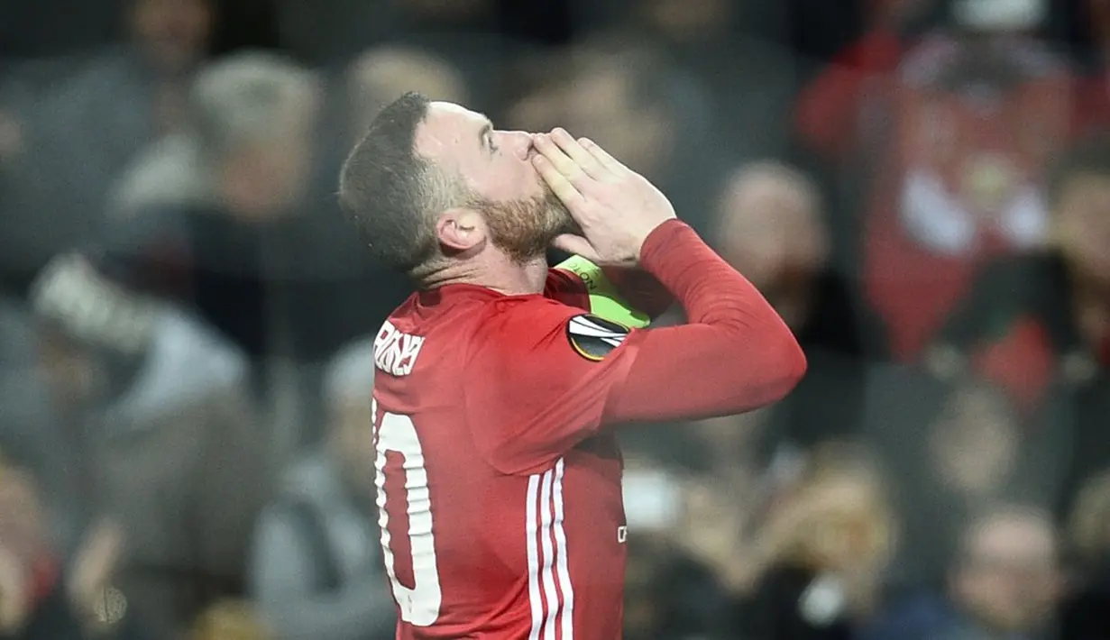 Manchester United meraih kemenangan 4-0 atas Feyenoord pada matchday kelima Grup A Liga Europa 2016-2017, di Stadion Old Trafford, Jumat (25/11/2016) dini hari WIB. Wayne Rooney mencetak gol pertama MU. (AFP/Oli Scarff)