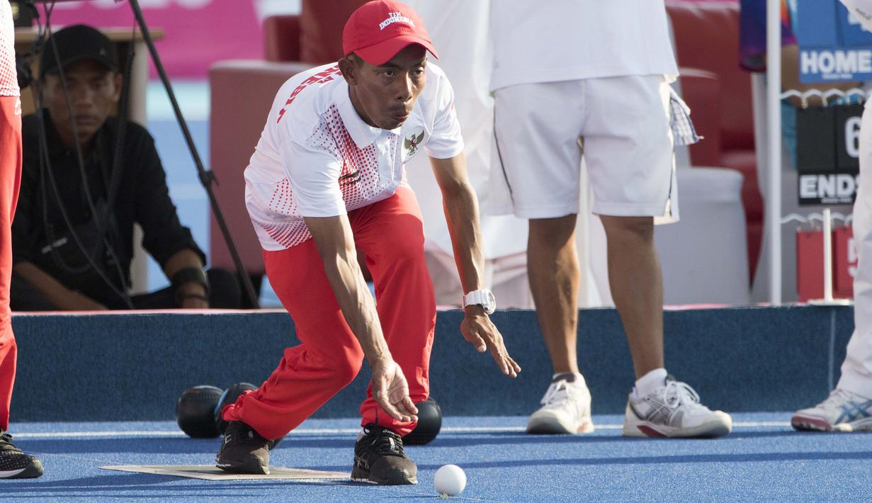 Kacung atlet Lawnball Indonesia bertanding di nomor B2 Open Single's pada Asian Para Games 2018 di Stadion Hockey, Gelora Bung Karno Jakarta, Senin (8/10/2018).  (Bola.com/Peksi Cahyo)
