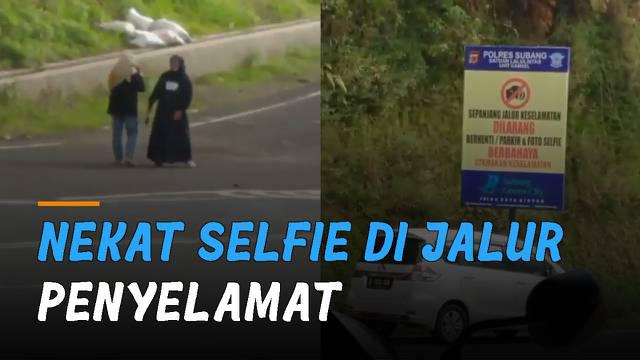 video memperlihatkan dua emak-emak nekat berfoto selfie di jalur penyelamat. Kejadian itu terjadi di kawasan Subang, Jawa Barat.