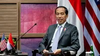 Presiden Joko Widodo saat melakukan pertemuan bilateral dengan Presiden Amerika Serikat (AS) Joe Biden Nusa Dua, Bali (14/11/2022). Pertemuan digelar menjelang Konferensi Tingkat Tinggi (KTT) G20. (AFP/Saul Loeb)