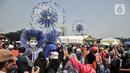 Masyarakat yang menghabiskan waktu untuk berolahraga dan berlibur di kawasan Monas ikut serta singgah menengok semaraknya perhelatan Lebaran Betawi. (merdeka.com/Iqbal S. Nugroho)(merdeka.com/Iqbal S. Nugroho)