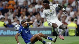 Meski meraih kemenangan, Real Madrid harus bermain ekstra untuk susah payah menembus pertahanan ketat Marseille yang dikawal duet Leonardo Balerdi dan Facundo Medina. (Oscar DEL POZO/AFP)