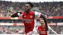 Selebrasi bek Arsenal, Nuno Tavares setelah mencetak gol ke gawang Manchester United dalam laga Liga Inggris 2021/2022 di Emirates Stadium, London (30/4/2022). Pemain asal Portugal ini didatangkan Arsenal pada awal musim 2021/2022 dari Benfica sebagai alternatif di sektor kiri pertahanan. Namun akibat performa yang tak maksimal, ia akhirnya dipinjamkan ke Olympique Marseille sejak awal musim 2022/2023. (AFP/Ian Kington)