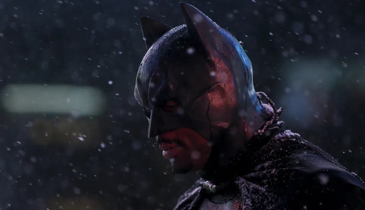 Seorang pria berpakaian seperti "Batman" berdiri saat salju mulai turun di Times Square di Manhattan borough New York, (23/1/2016). (REUTERS/Carlo Allegri)
