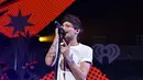 Momen haru telah tercipta saat Louis menggendong Freddie Tomlinson, yang tak lain adalah putra pertamanya yang berusia 2 bulan. (AFP/Bintang.com)