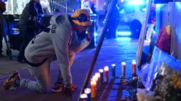 Peristiwa tragis itu menewaskan 14 orang dan sedikitnya 35 lainnya terluka, termasuk dua petugas polisi. (ANDREW CABALLERO-REYNOLDS/AFP)