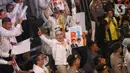Para pendukung dari pasangan calon gubernur dan wakil gubernur DKI Jakarta saat menghadiri dan menyaksikan pengundian nomor urut pasangan di kantor Komisi Pemilihan Umum (KPU) Provinsi DKI Jakarta, Senin (23/9/2024). (Liputan6.com/Angga Yuniar)