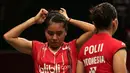 Nitya memperbaiki rambutnya supaya tidak mengganggu saat bertanding. (Bola.com/Arief Bagus)