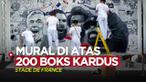 Berita video mural unik bergaya komik yang dibuat di atas 200 boks kardus hadir jelang laga Final Liga Champions, Liverpool vs Real Madrid.