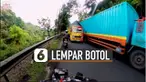 Uniknya, botol minum tersebut masuk di sela-sela jendela sopir truk.