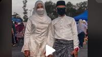 Pasangan asal Malaysia kunjungi pasar malam saat masih berbaju pengantin (dok.TikTok/@amir_firdaus8/https://www.tiktok.com/@amir_firdaus8/video/7027481037173280026?is_copy_url=1&is_from_webapp=v1/Komarudin)