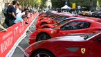 Deretan mobil asal Italia, Ferrari dipamerkan saat perayaan ulang tahun Ferrari ke-70 di Corso Sempione di Milan, Italia (8/9). Dalam acara ini sekitar 500 mobil Ferrari dari berbagai tipe pamerkan. (AFP Photo/Miguel Medina)