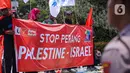Dalam aksinya mereka mendesak agar perang Hamas dan Israel segera dihentikan. (Liputan6.com/Faizal Fanani)