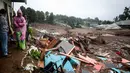Dari jumlah tersebut masih terdapat 18 kantong jenazah yang hingga kini masih dalam proses identifikasi. Tampak dalam foto, puing-puing rumah yang hancur tersisa setelah tanah longsor melanda Desa Pasirlangu di Cisarua, Kabupaten Bandung, Jawa Barat, pada 24 Januari 2026. (Timur Matahari/AFP)
