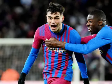 Barcelona berhasil meraup poin penuh saat bersua Sevilla pada laga pekan ke-30 La Liga. Mayoritas pemain Barca tampil impresif dalam pertandingan ini, dua di antaranya adalah Pedri dan Dembele. (AFP/Lluis Gene)