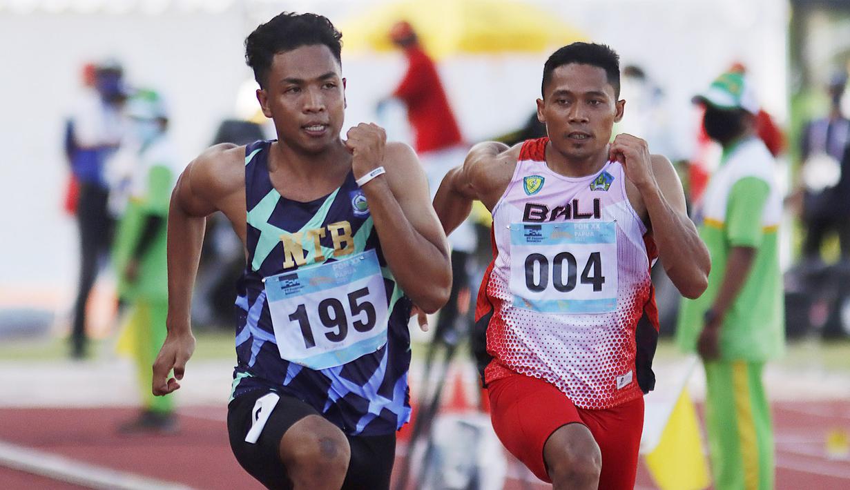 Lalu Mohammad Zohri pelari 100 meter putra asal Nusa Tenggara Barat (kiri) saat beraksi pada PON XX Papua 2021 di Stadion Atletik  Mimika Sport Complex, Kabupaten Mimika, Papua, Rabu (6/10/2021). (Foto: PB PON XX PAPUA 2021/ Ady Sesotya)