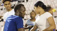 Usain Bolt mesra dengan kekasihnya Kasi Bennett  (www.forumspotz.ng)