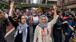 Para pengunjuk rasa berbaris melewati Grand Central menuju Perserikatan Bangsa-Bangsa (PBB) untuk memprotes tindakan Perdana Menteri Israel Benjamin Netanyahu di Timur Tengah pada tanggal 26 September 2024 di New York City. (Alex Kent/Getty Images North America/Getty Images via AFP)