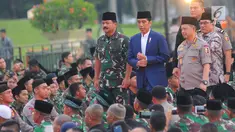 Presiden Joko Widodo bersama Panglima TNI Marsekal Hadi Tjahjanto dan Kapolri Jenderal Tito Karnavian tiba menghadiri buka puasa bersama dengan Keluarga Besar TNI - Polri dan Masyarakat di Lapangan Monas, Jakarta, Kamis (16/5). (Liputan6.com/Angga Yuniar)