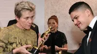 Frances McDormand, bersama putranya, Pedro, terlihat memegang piala Oscar-nya, sesaat sebelum diduga dicuri. (AFP / Angela Weiss)