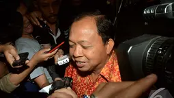 Wayan diperiksa sebagai saksi bagi tersangka Muhtar Ependy, terkait sangkaan menghalangi dan merintangi persidangan serta memberikan keterangan tidak benar, Selasa (2/9/2014) (Liputan6.com/Faisal R Syam)