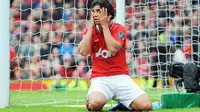 Manchester United's Brazilian defender Rafael Da Silva reacts after missing a chance to score during the EPL match against Queens Park Rangers at Old Trafford, on April 8, 2012. AFP PHOTO/ANDREW YATES