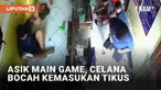 Keberadaan tikus di pemukiman dan tempat usaha kerap mengganggu. Tak terkecuali di tempat usaha rental PS berikut. Seekor tikus tiba-tiba berlari ke barisan bocah yang tengah asik bermain game.
