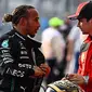 Pembalap Mecedes, Lewis Hamilton (kiri) dan pembalap Ferrari, Charles Leclerc didiskualifikasi dari Formula 1 GP Amerika Serikat karena melanggar regulasi teknis. (AFP/Chandan Khanna)