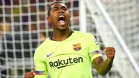 Penyerang Barcelona, Malcom Silva berselebrasi usai mencetak gol ke gawang AS Roma pada pertandingan International Champions Cup (ICC) di AT & T Stadium di Arlington, Texas (31/7). Roma menang telak 4-2 atas Barcelona. (AFP Photo/Cooper Neill)