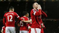 Rooney melakukan selebrasi usai cetak gol ke gawang Stoke (Reuters)