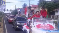 Liliyana Natsir pulang kampung diarak keliling kota Manado (Liputan6.com / Yoseph Ikanubun)