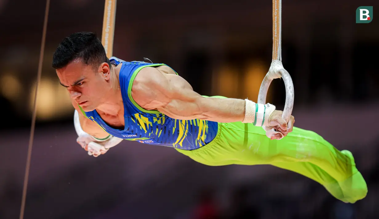 <p>Pesenam Brasil, Caio Souza beraksi pada nomor gelang-gelang final aparatus putra Kejuaraan Dunia Gimnastik 2025 di Indonesia Arena, Senayan, Jakarta, Jumat (24/10/2025). (Bola.com/Bagaskara Lazuardi)</p>