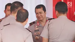 Wakapolda Metro Jaya, Brigjen Pol Purwadi saat tiba untuk mengikuti apel besar di lapangan Sabhara Mapolda Metro Jaya, Jakarta, Sabtu (12/5). (Liputan6.com/Herman Zakharia)