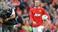 Striker Manchester United Wayne Rooney seusai mencetak hat-trick ke gawang Arsenal dalam lanjutan EPL di Old Trafford, 28 Agustus 2011. MU unggul 8-2. AFP PHOTO/ANDREW YATES