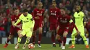 Striker Barcelona, Lionel Messi, berusaha melewati pemain Liverpool pada laga semifinal Liga Champions 2019 di Stadion Anfield, Selasa (7/5). Liverpool menang 4-0 atas Barcelona. (AP/Dave Thompson)