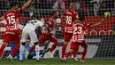 <p>Empat gol kemenangan Girona diborong Valentin Castellanos. Sementara gol-gol Real Madrid dibuat Vinicius Junior dan Lucas Vazquez. (AP Photo/Joan Monfort)</p>