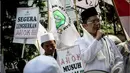 Dalam aksinya mereka menuntut Wakil Gubernur Basuki Tjahaja (Ahok) untuk mundur dari jabatannya dan hengkang dari Jakarta, Jakarta, Jumat (24/10/2014) (Liputan6.com/Faizal Fanani)