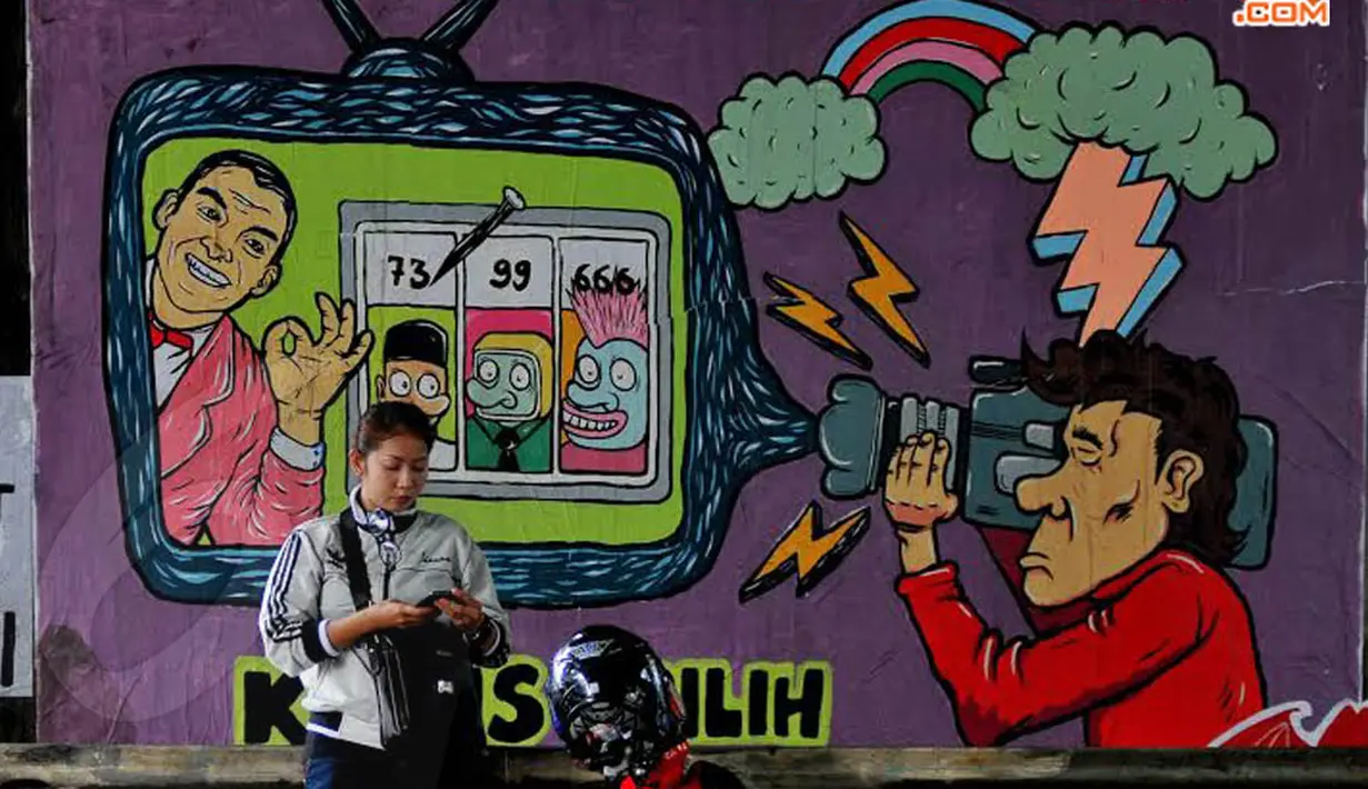 Dalam mural tersebut berisi pesan ajakan pada masyarakat untuk menggunakan hak pilihnya dalam Pemilu yang berlangsung April 2014 mendatang (Liputan6.com/Johan Tallo)