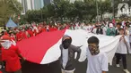 Massa yang tergabung dalam Masyarakat Penegak Demokrasi (MPD) menggelar aksi damai "Menyambut Pelantikan Presiden dan Wapres RI Terpilih" di Kawasan Patung Kuda, Jakarta, Kamis (10/10). Mereka mengimbau masyarakat menjaga situasi aman dan damai jangan terprovokasi. (Liputan6.com/Herman Zakharia)