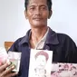 Pria asal Brondong Lamongan, Edy Santoso (45), fotonya terpampang di bungkus rokok. (merdeka.com)