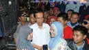 Kedatangan pria yang masih menjabat sebagai Gubernur DKI itu pun praktis menyedot perhatian warga (Liputan6.com/Herman Zakharia)