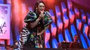 Pemilik nama lengkap Andien Aisyah Haryadi itu tampil dengan gaun batik warna-warni. Ia membawakan lagu-lagu hits lawasnya. Ibu satu anak itu tampil di Dalam Hall A1 Garuda Indonesia Stage. (Adrian Putra/Bintang.com)